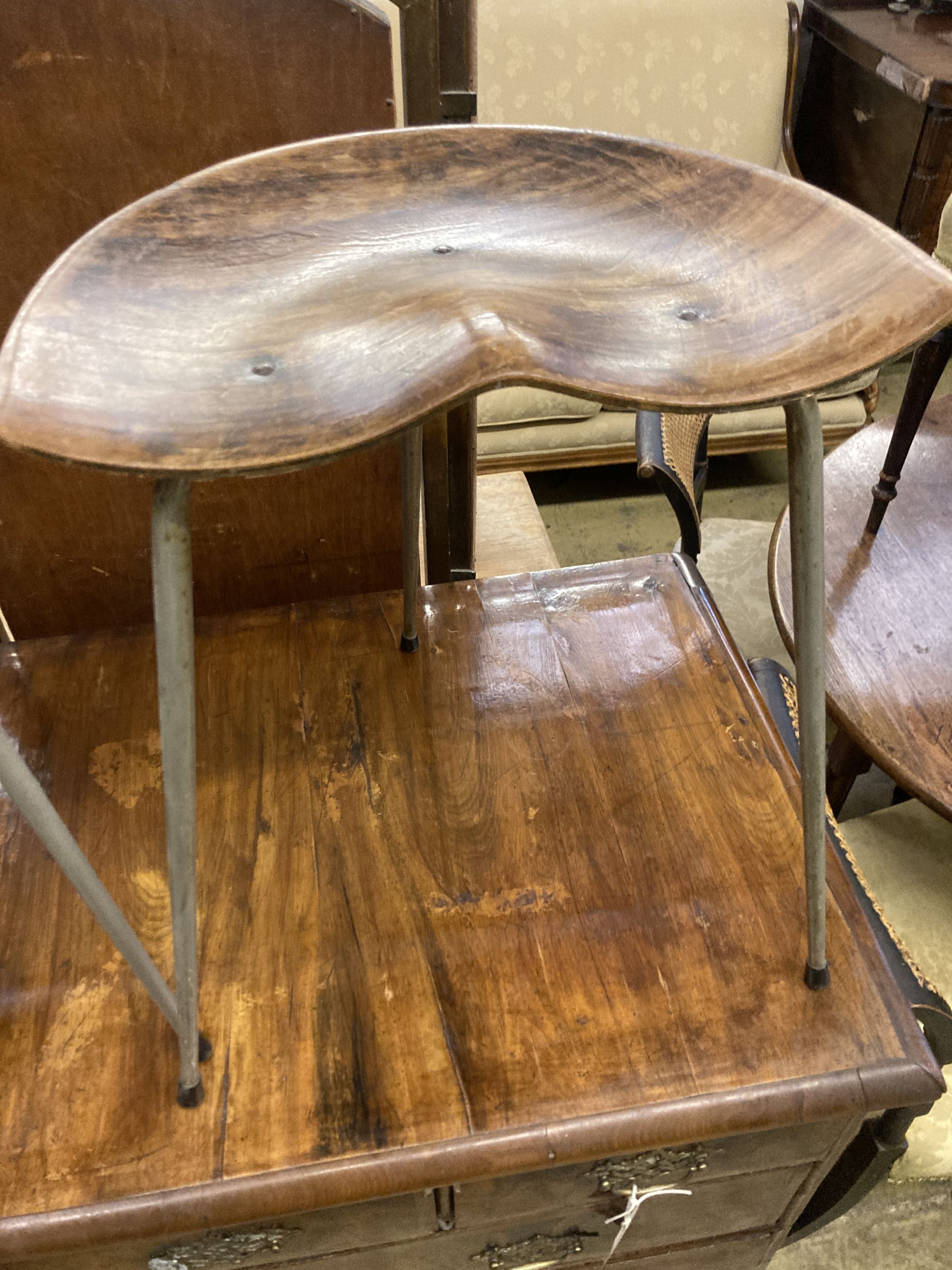 A pair of Arne Jacobsen-style saddle seat stools, width 39cm, depth 25cm, height 48cm